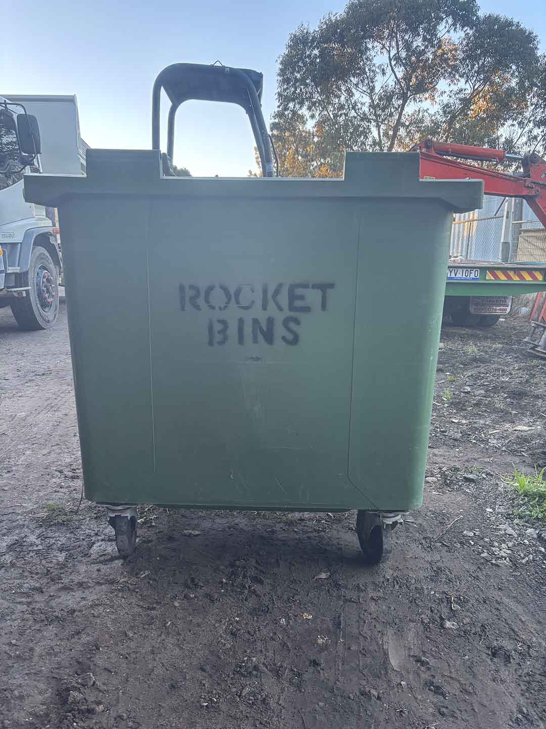 s8a Green 660L wheelie bin stencilled ROCKET BINS, front view
