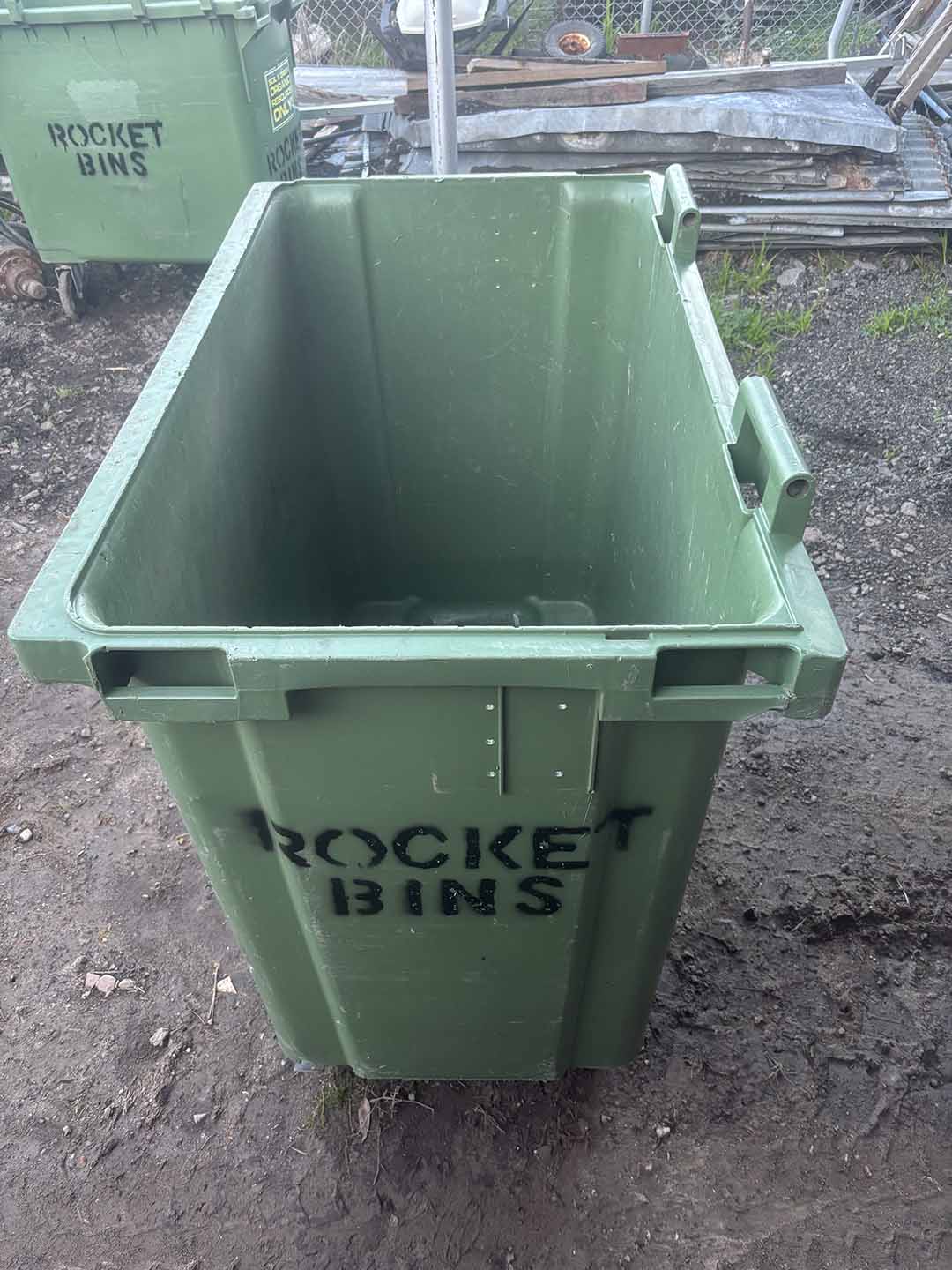 s8b Green 660L wheelie bin stencilled ROCKET BINS, open and seen from above